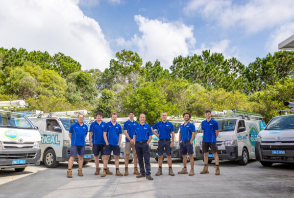 North Lakes and Surrounds Electrical team in front of Vans